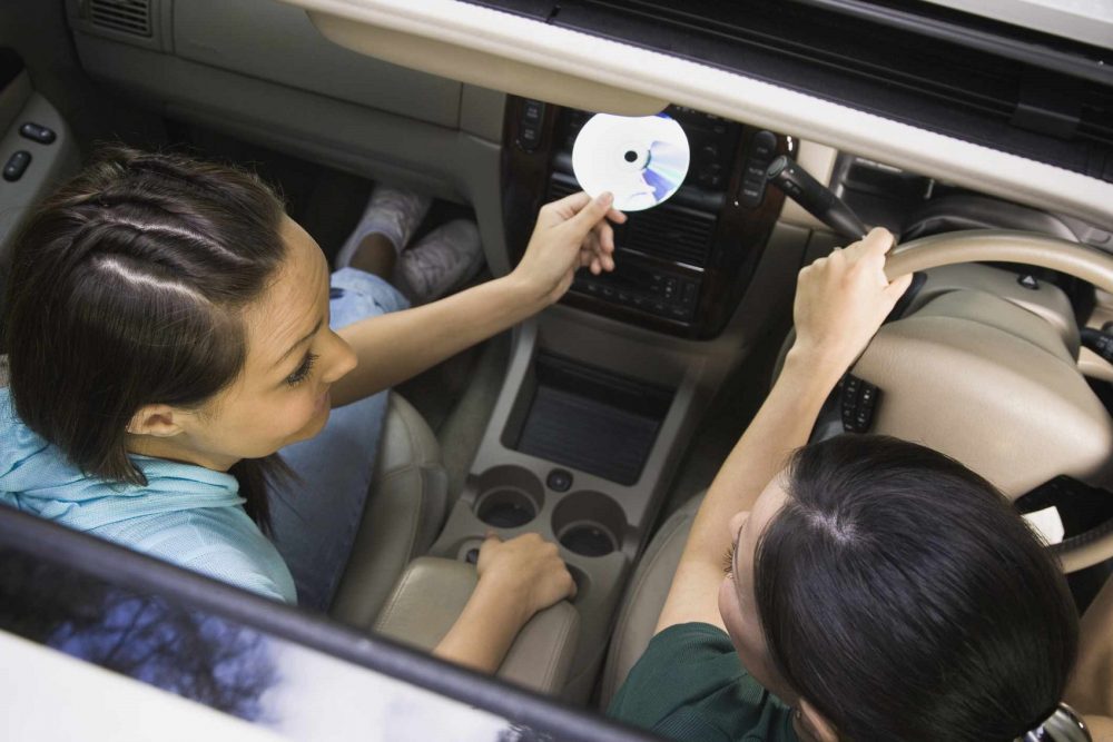 Method to play music in CDs without a CD player in the car